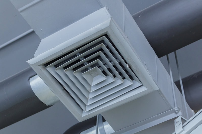 Large ceiling air vent is part of a commercial HVAC system and contributes toward air quality.